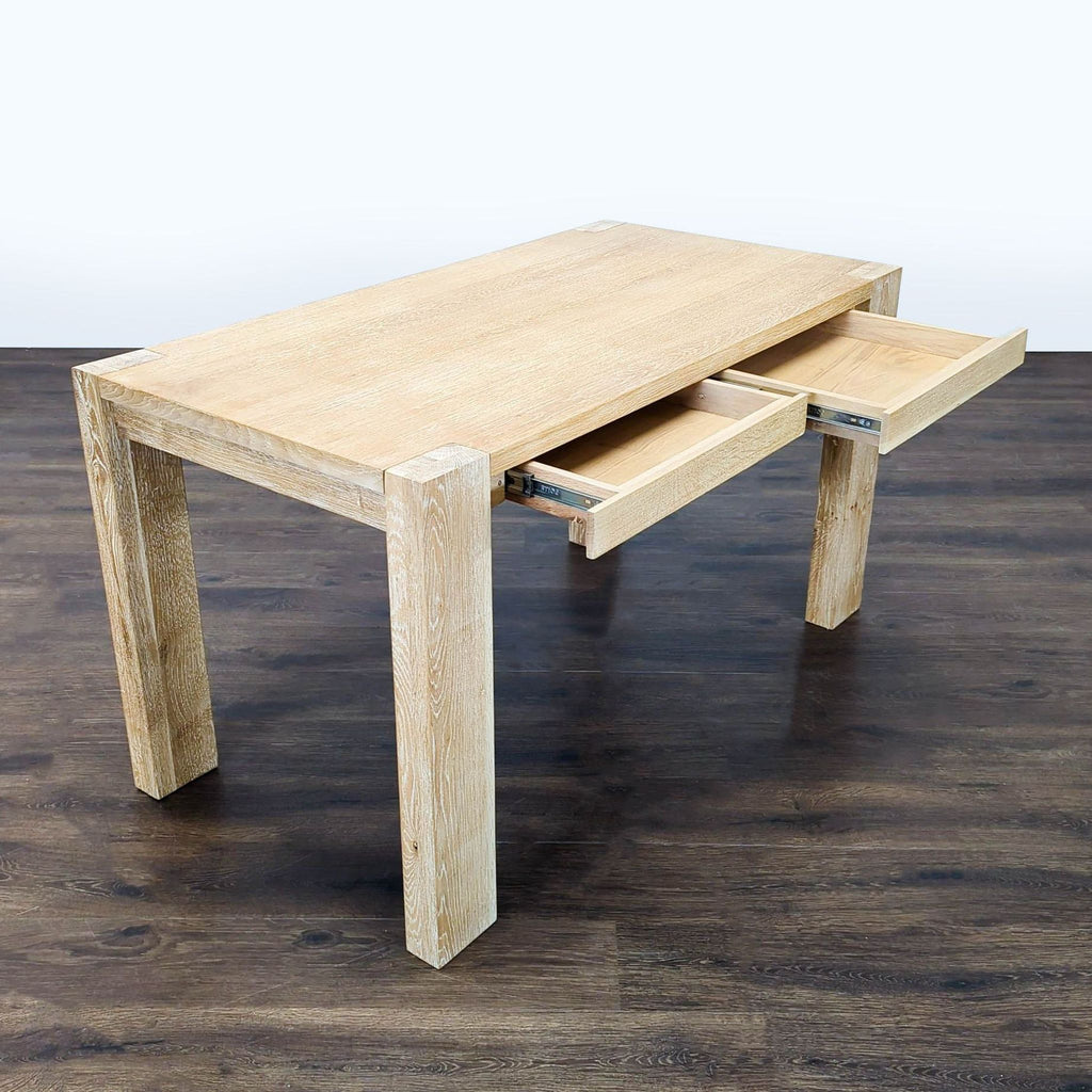 Modern Crate and Barrel desk shown with drawers open, ideal for organizing office supplies in style.