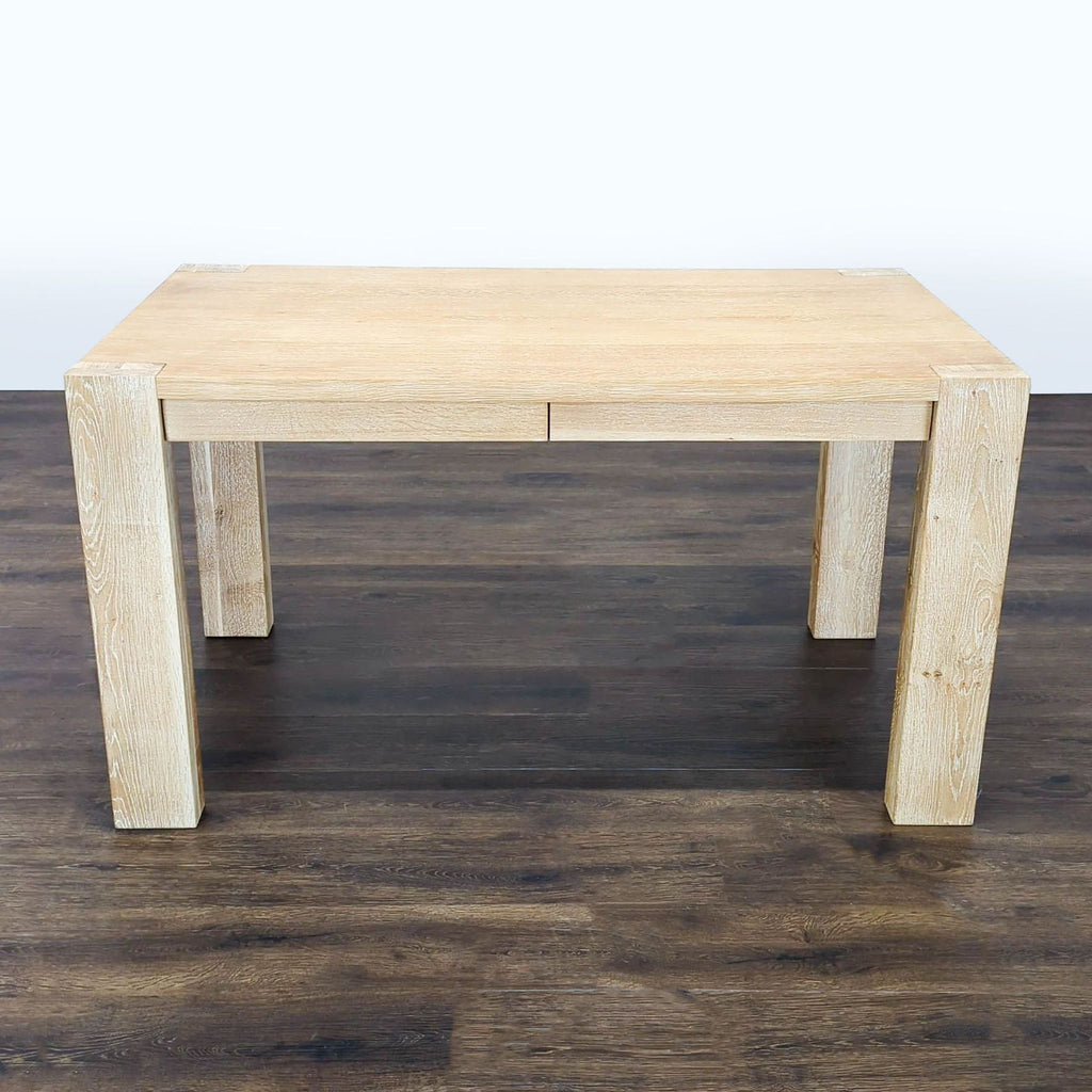 Sturdy light-wood Crate and Barrel desk with clean lines and two drawers, perfect for modern home offices.