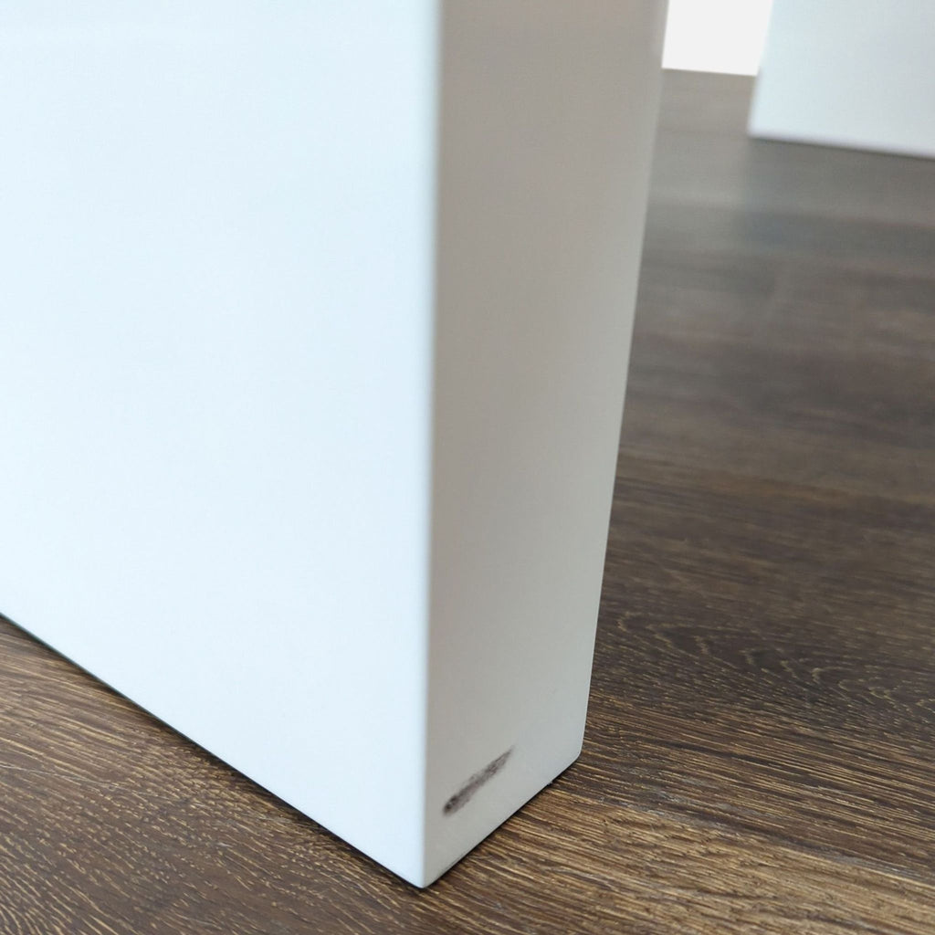 Contemporary white desk by CB2, offering smooth-gliding drawers and a clean, versatile design.