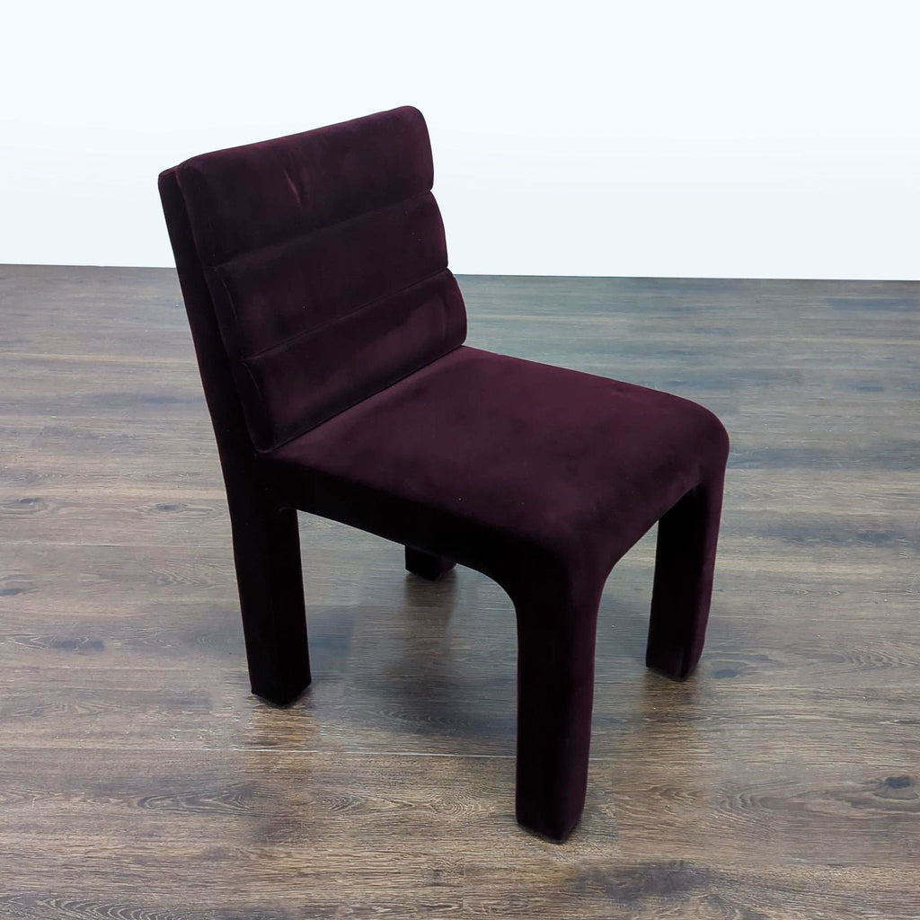 Purple velvet dining chair from CB2 featuring stylish channel tufted back and sleek design for dining spaces.