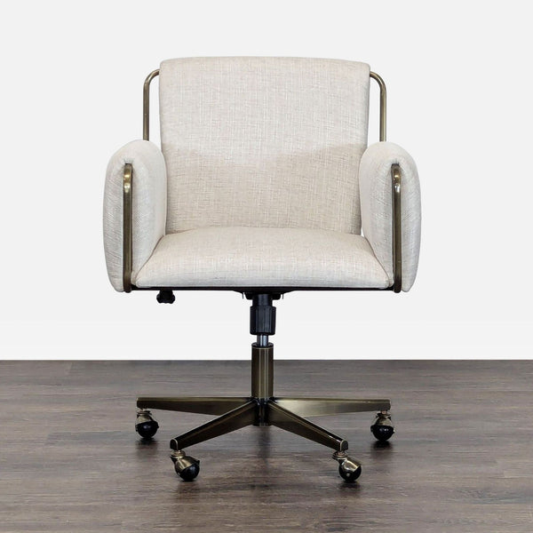 Modern Crate and Barrel office chair with light beige upholstery, padded arms, and rolling wheels.