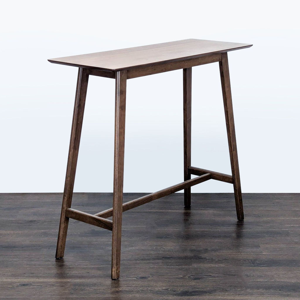 2. Modern walnut dining table featuring elongated top and splayed legs, by Noble House Home.  