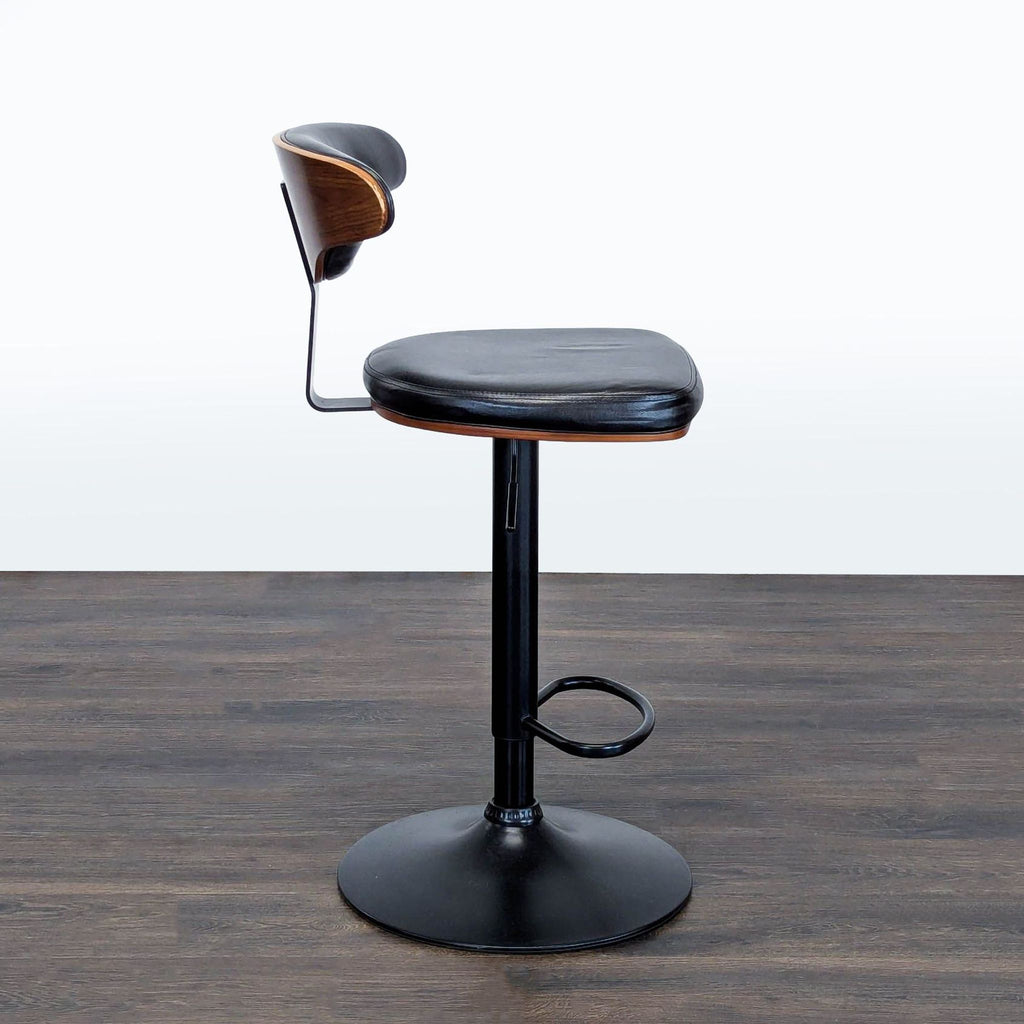 Stool by Ashley Furniture featuring adjustable seat height and a convenient footrest for comfort.