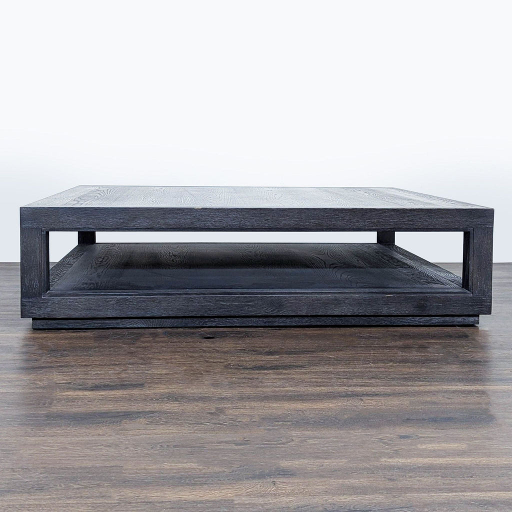 3. Minimalist dark wood coffee table with squared edges and open lower storage, viewed from the front on hardwood.