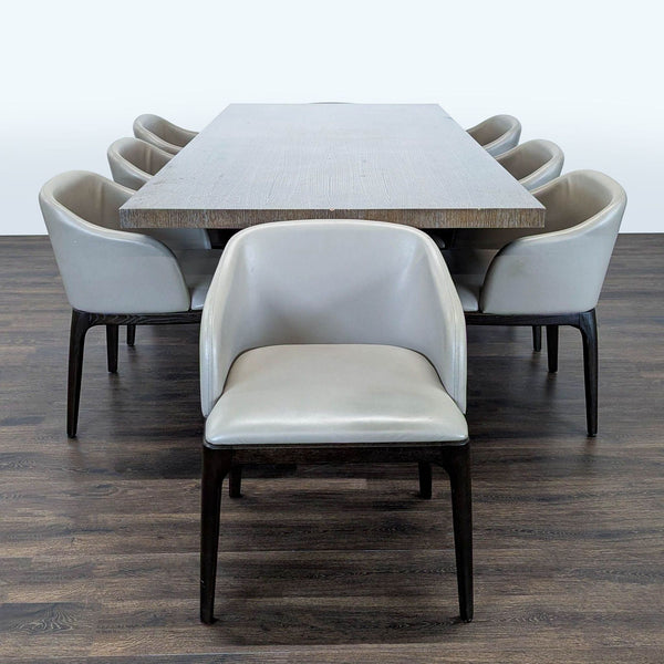 Large rectangular wood dining table with eight leather chairs by Moniker Home, seats eight, modern design.