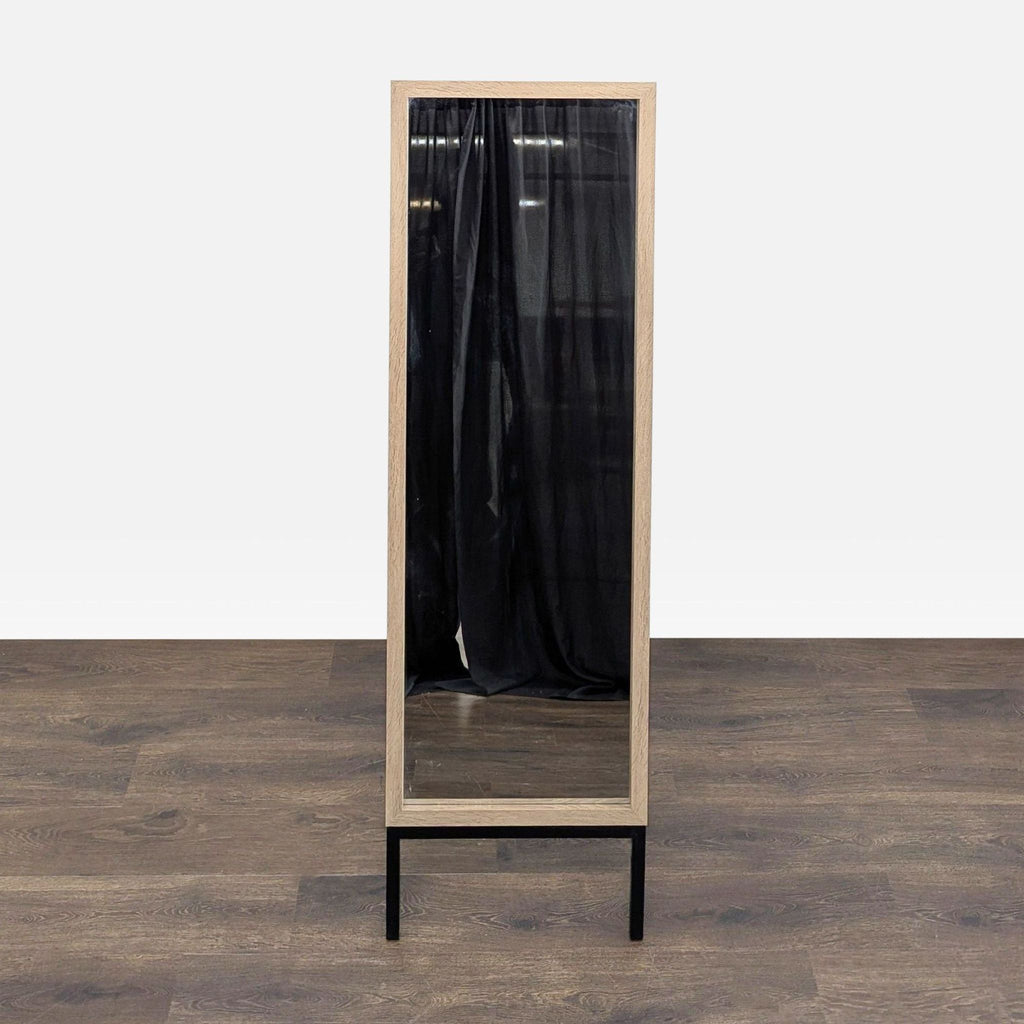 Full-length wood-framed mirror by MCS Industries on a collapsible stand.