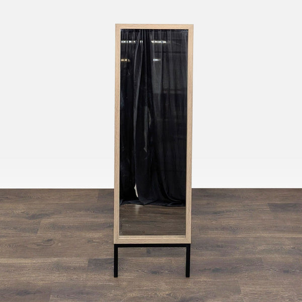 Full-length wood-framed mirror by MCS Industries on a collapsible stand.