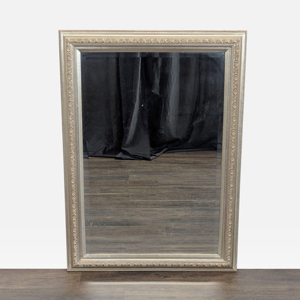 Beveled mirror with a silver gilt frame from Carolina Mirror Company.  