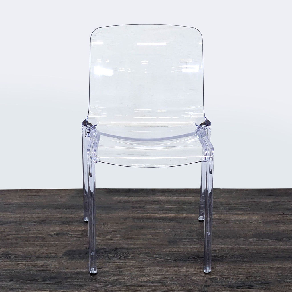LeisureMod dining chair with transparent acrylic seat and metal base, contemporary style.