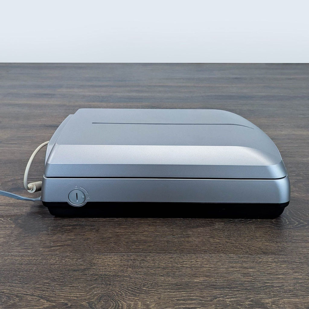 Epson flatbed scanner for home or office, featuring easy computer connection and reliable performance.