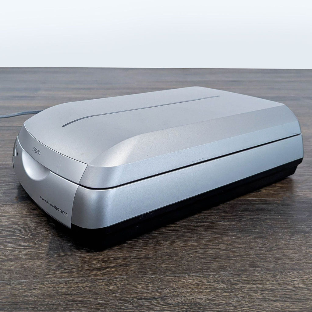 Sleek Epson photo scanner in excellent condition, designed for high-quality scans of images and documents.