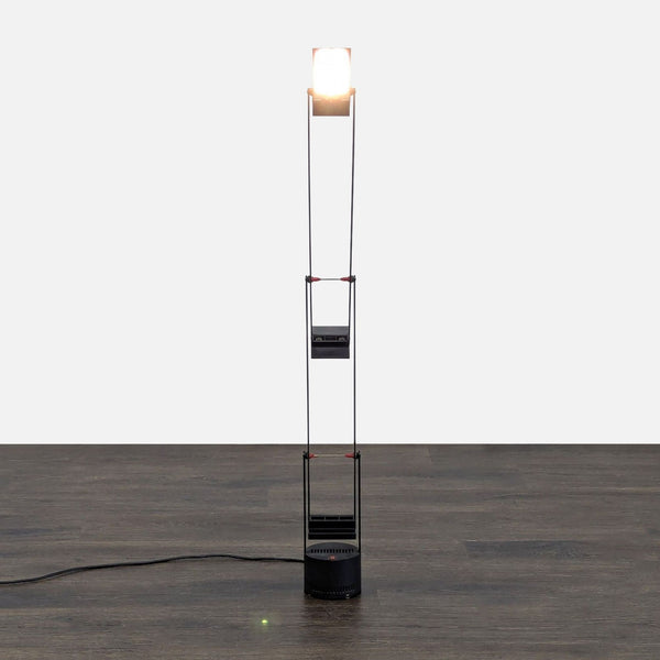 Sleek black Artemide desk lamp with adjustable arms, ideal for modern workspaces or reading areas.