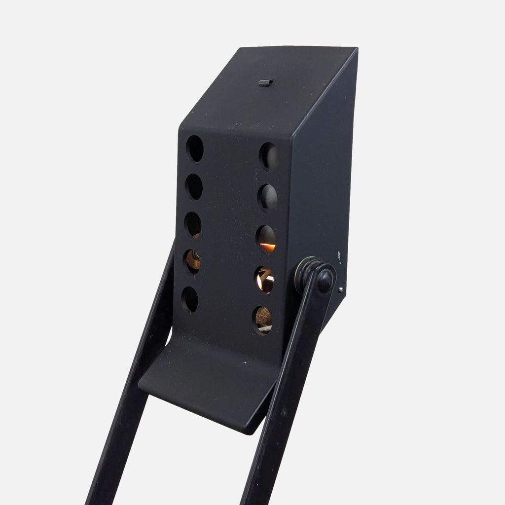 Contemporary black Artemide desk lamp featuring flexible arms, perfect for focused lighting in any workspace.