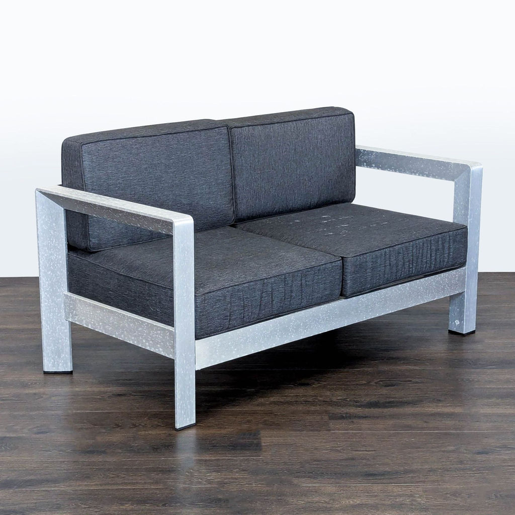 Sturdy gray-cushioned 2-seater chair for outdoors, featuring supportive armrests; Christopher Knight brand.