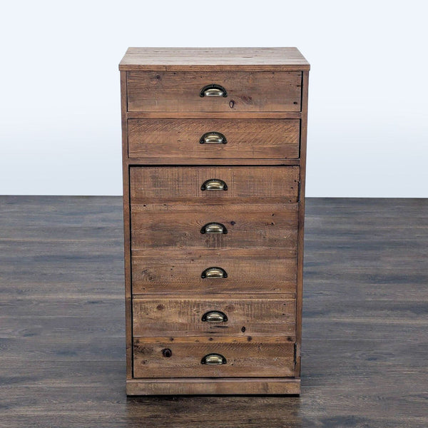 Reclaimed wood cabinet by Pottery Barn with front drawers and lower shelf, suitable for storage.  