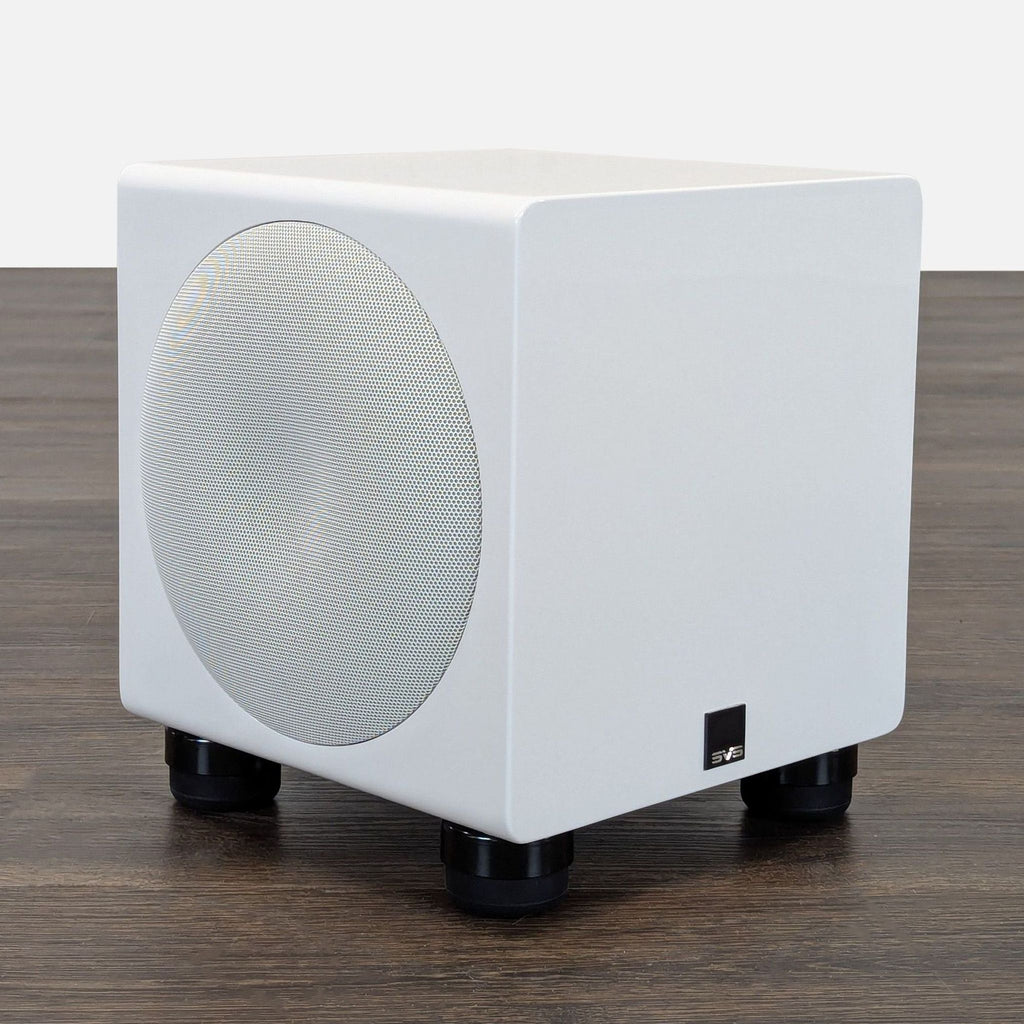SVS audio subwoofer in minimalist white finish, ideal for adding deep bass to music or theater rooms.