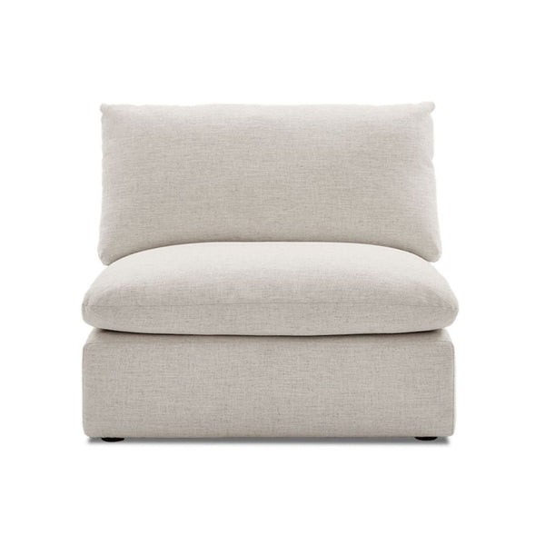 Castlery sectional armless chair with soft linen upholstery and plush cushions, shown in a modern living room.