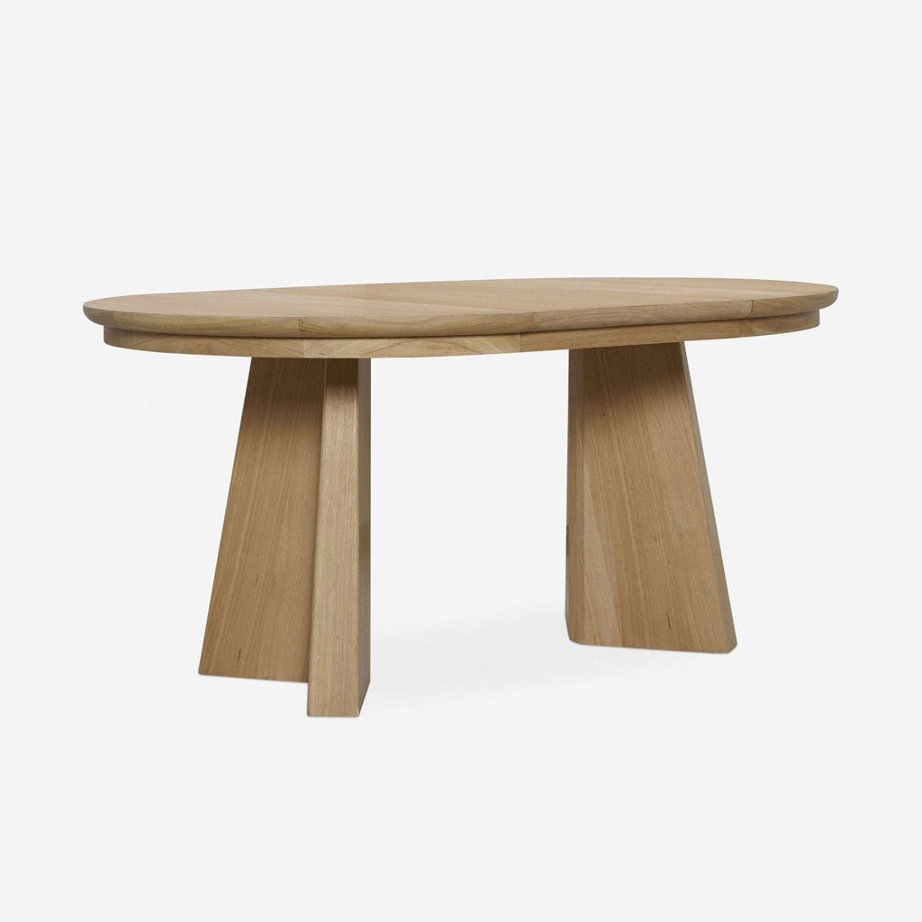 Lulu and Georgia oak dining table, round converts to oval, cross-pedestal base shifts to angular legs.