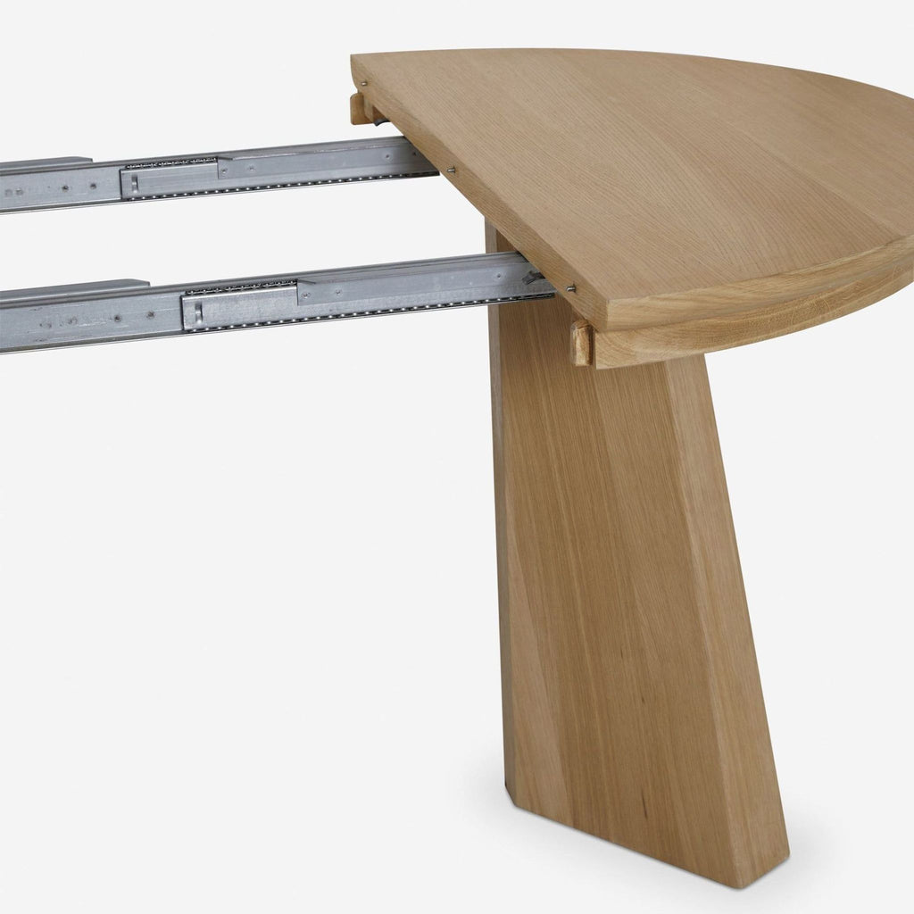 Extendable oak dining table with transformable base, transitions from round to oval, Lulu and Georgia brand.