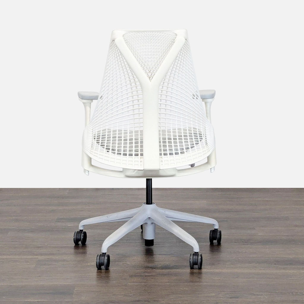 Herman Miller ergonomic chair with flexible mesh back, adjustable arms, and smooth wheels for home or office use.
