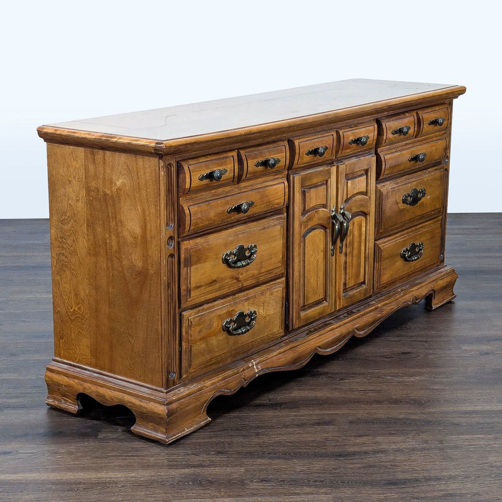 Sturdy wooden dresser with multiple drawers and a central storage cabinet, perfect for organizing clothes or linens.