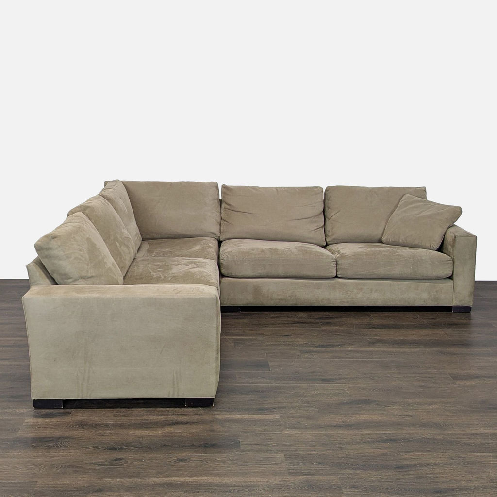 Spacious L-shaped Room & Board sectional with dark beige upholstery and plush cushions for comfortable seating.  