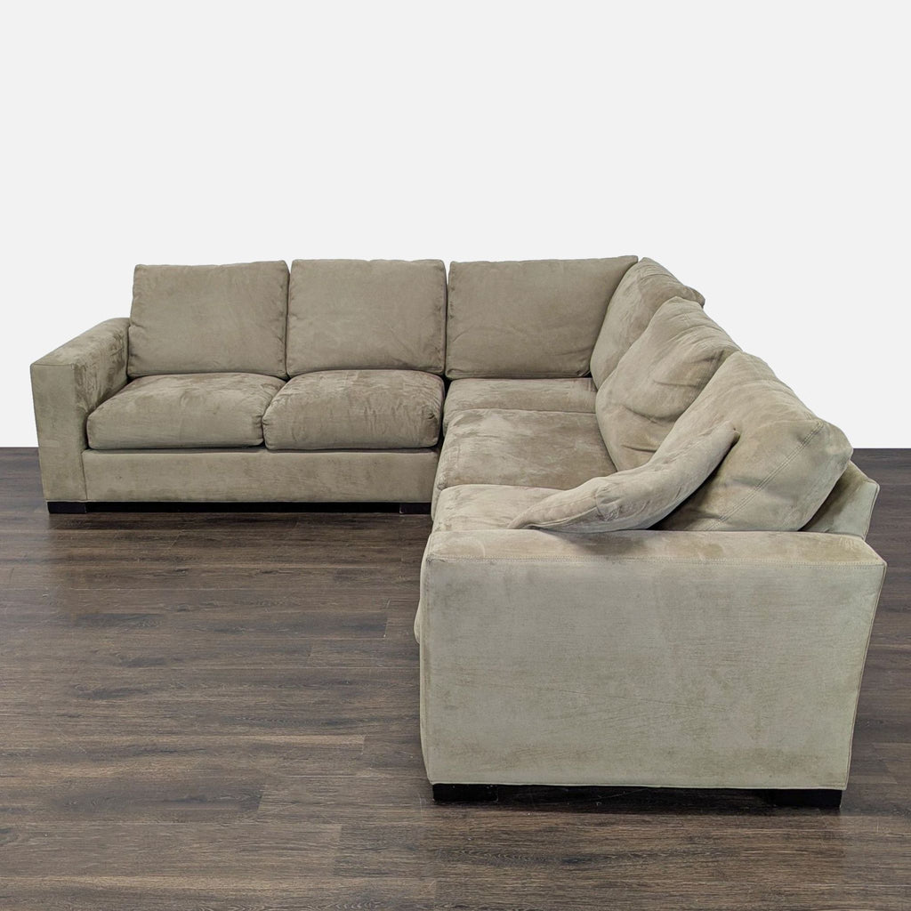 Room & Board sectional sofa in neutral dark beige, featuring clean lines and roomy seating for gatherings.  