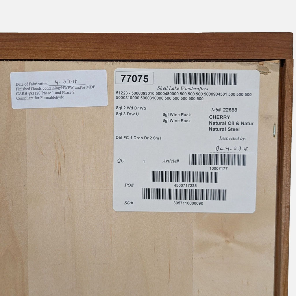 Room & Board cabinet features cherry wood, steel base, storage for 50 wine bottles, drawers, and a bar shelf.