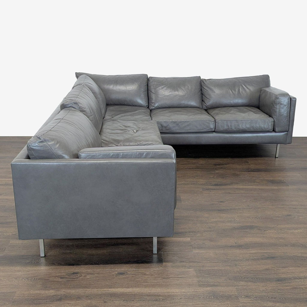 Stylish gray sectional sofa by BenchMade Modern featuring clean lines, spacious seating, and sturdy metal legs.  