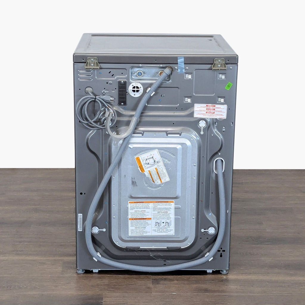 Stainless steel LG washer/dryer combo, user-friendly controls, efficient for laundry needs, category: Washer/Dryer.