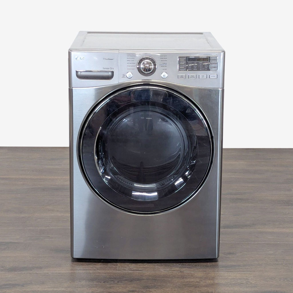 LG front load washer/dryer combo with stainless steel finish and digital controls, perfect for space-saving laundry.
