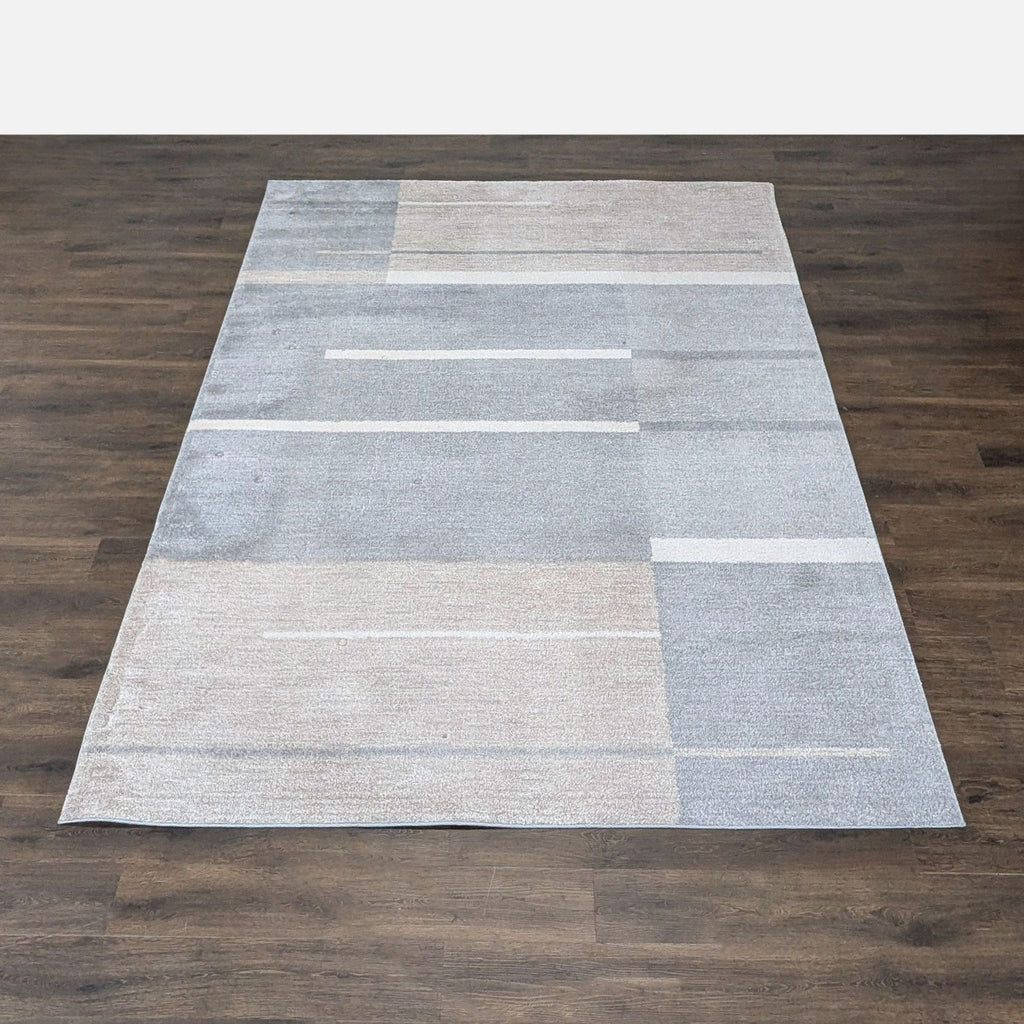 Modern Surya rug with geometric gray, beige, and cream pattern, ideal for adding soft comfort to any space.