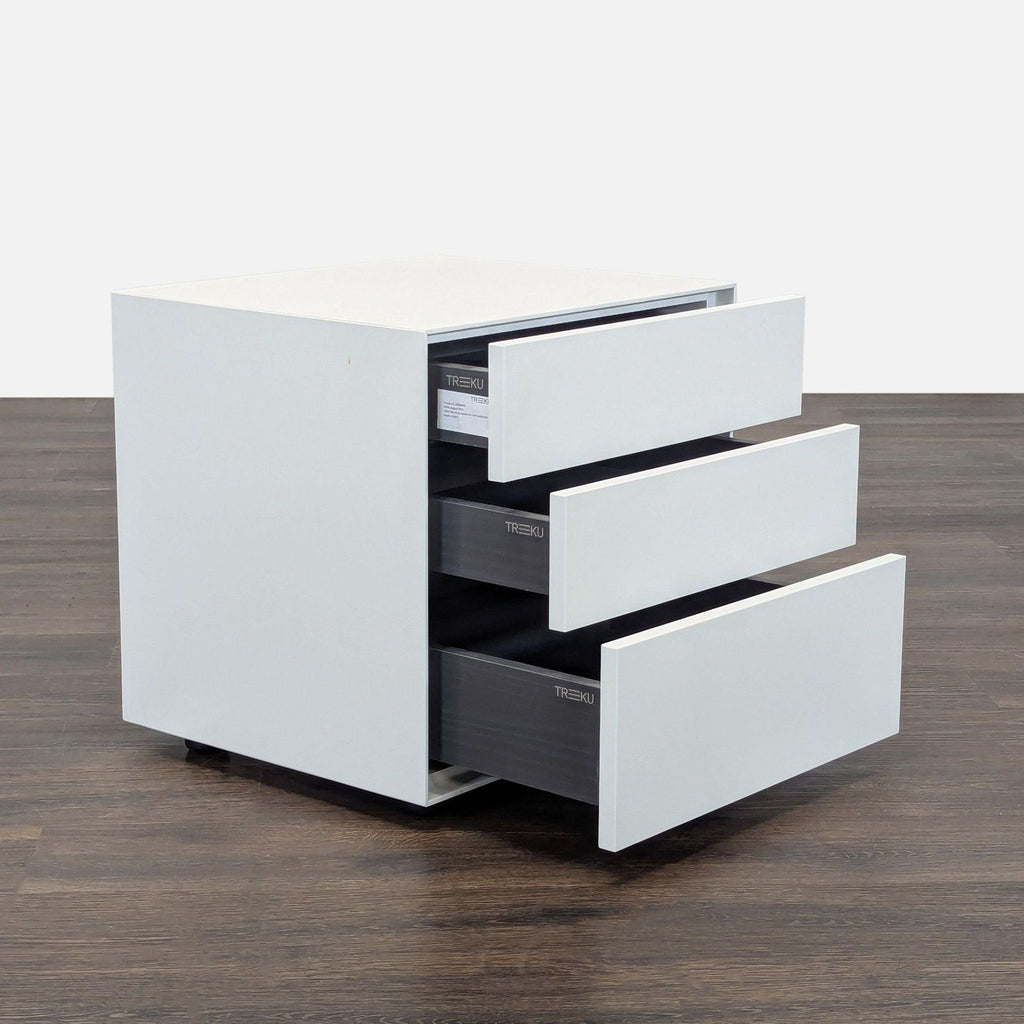 Contemporary Treku end table by Ibon Arrizabalaga, featuring a lacquered three-drawer design and adjustable floor glides.