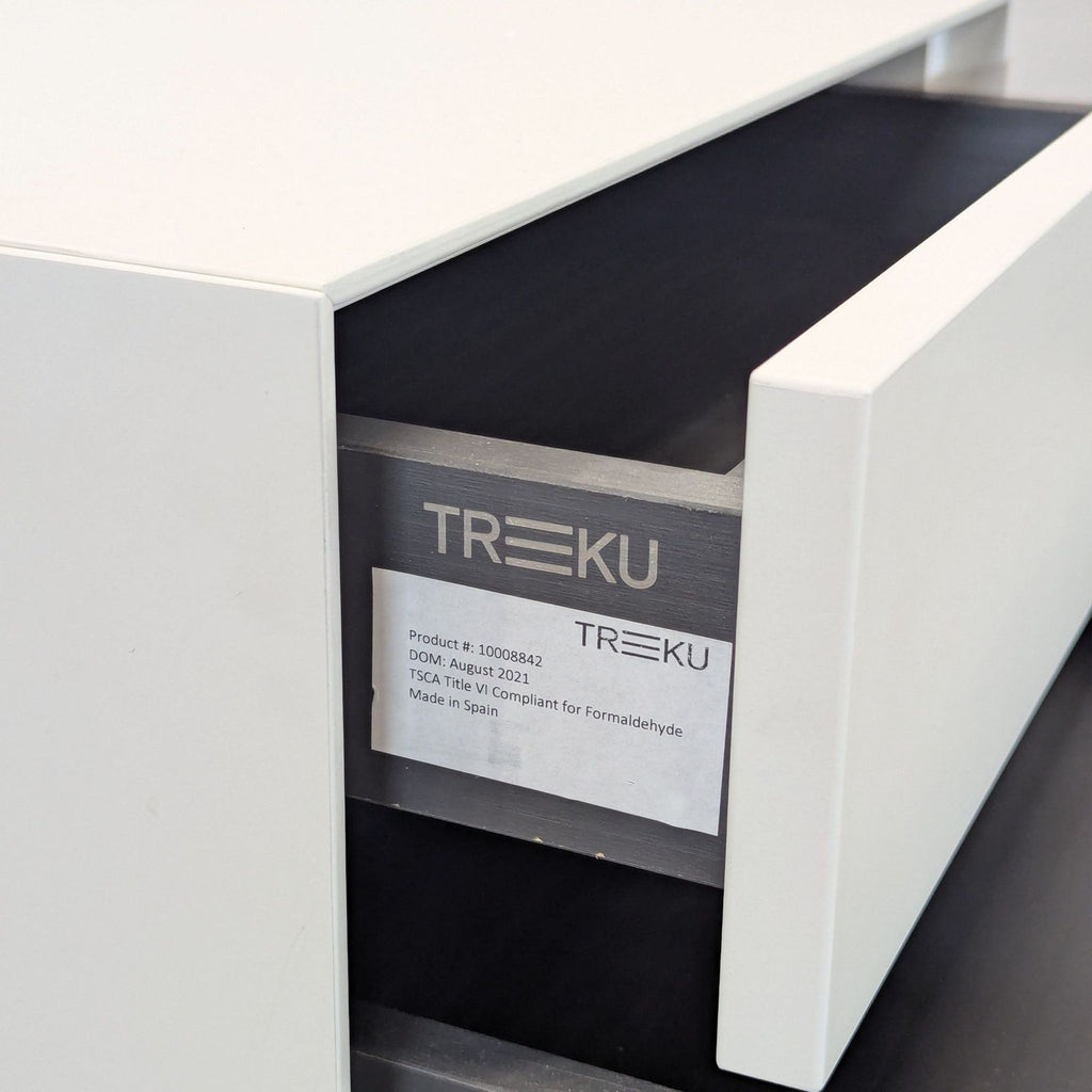 Treku three-drawer nightstand in lacquered MDF, made in Spain with minimalist lines and practical adjustable glides.