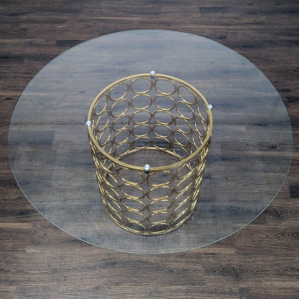 Meridian brand dining table base featuring gold stainless steel and a geometric metallic pattern.