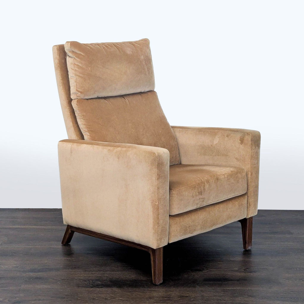 Room and Board lounge chair in tan, with sleek design, recline function, and wooden legs for living spaces.