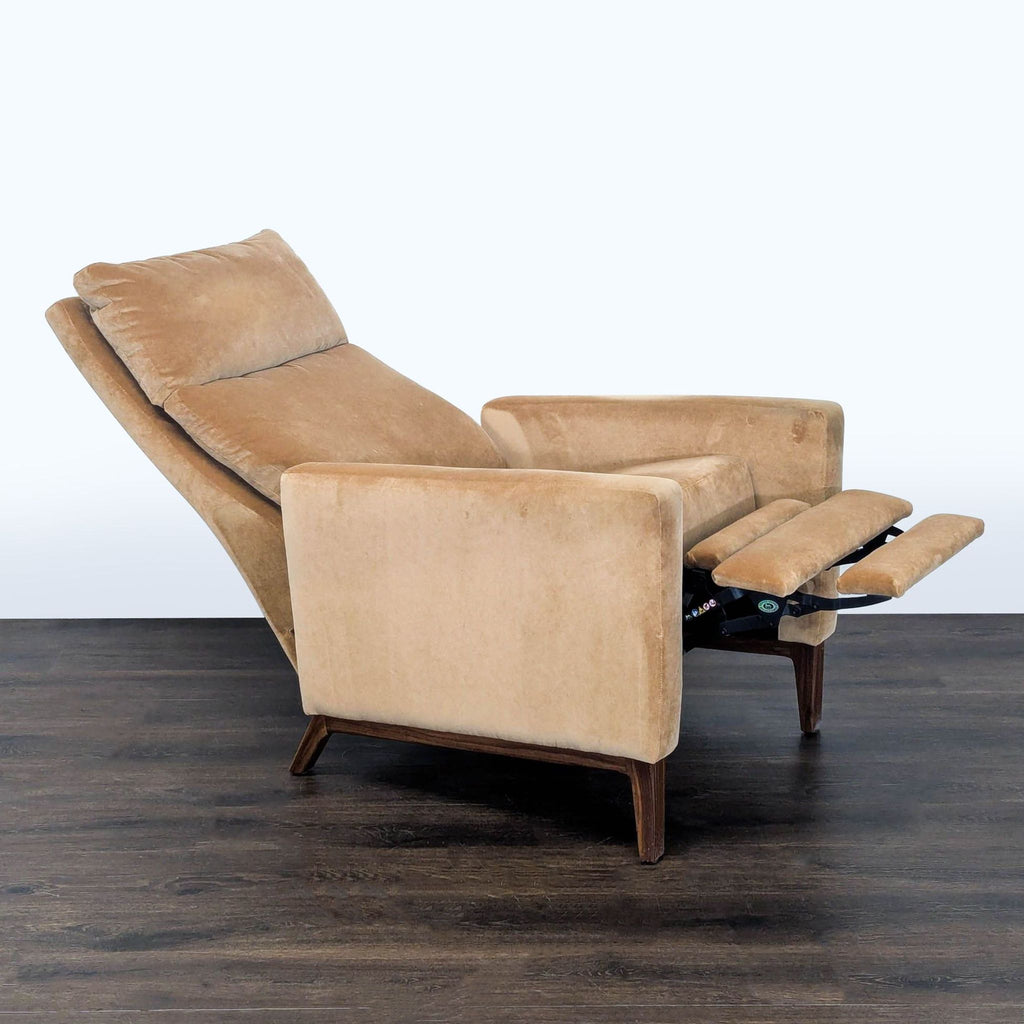Stylish tan lounge chair by Room and Board, featuring a soft fabric seat and sturdy wooden legs.