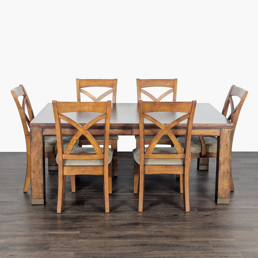 Classic Bassett dining set: sturdy wood table plus eight upholstered, cross-back chairs for family dining.