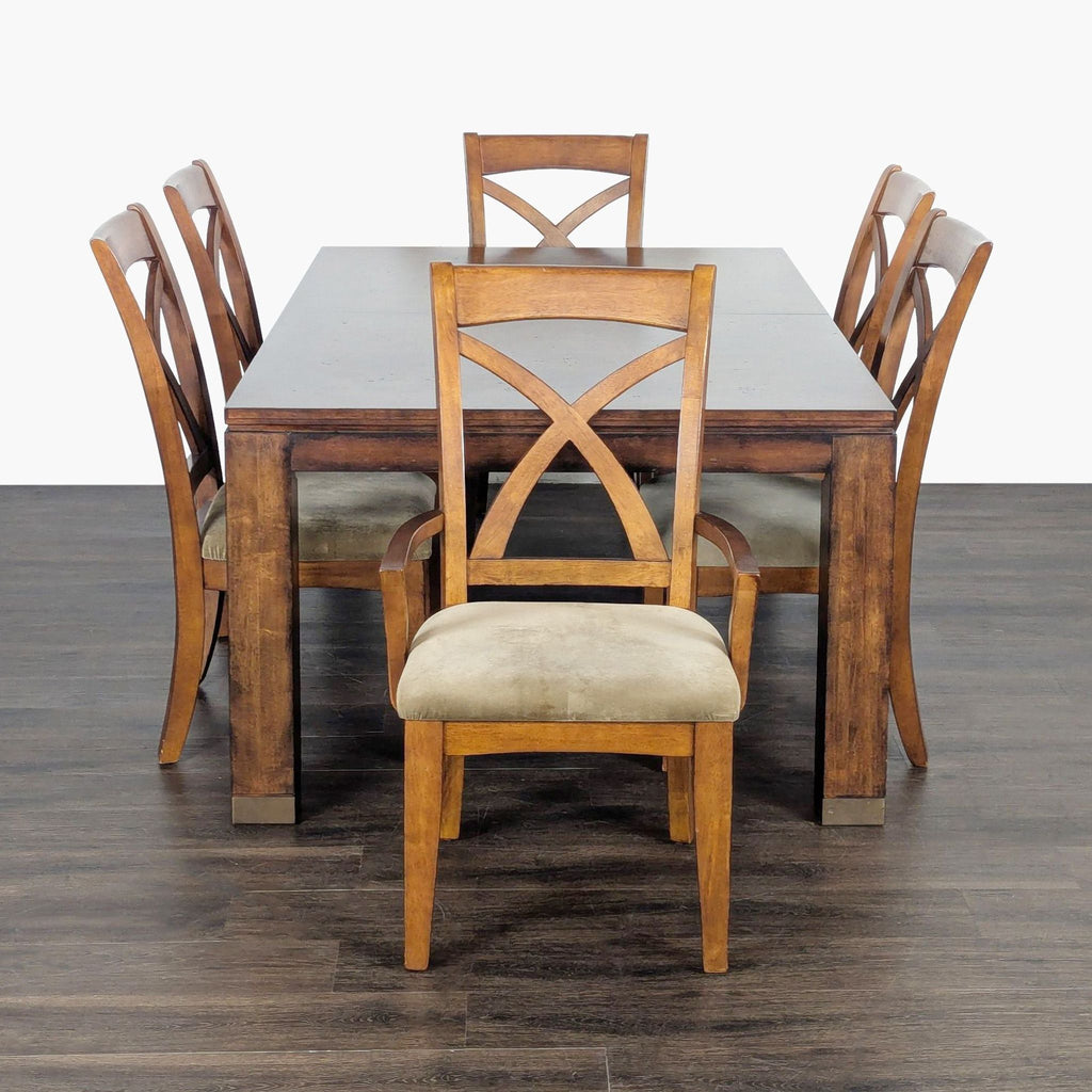 Wooden Bassett dining table with two leaves and eight matching cushioned chairs, classic design.