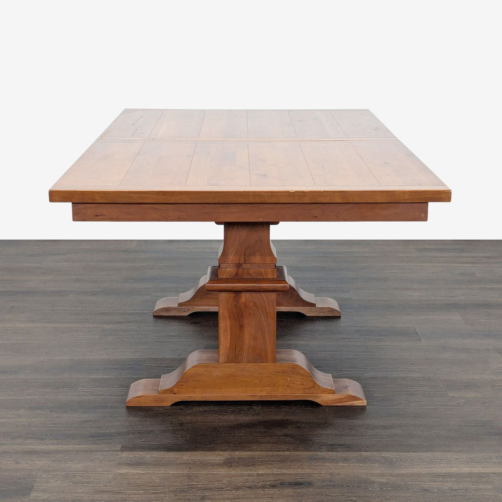 Expandable Amish Tables trestle dining table, leaves stored inside, extends up to 104.25 inches.