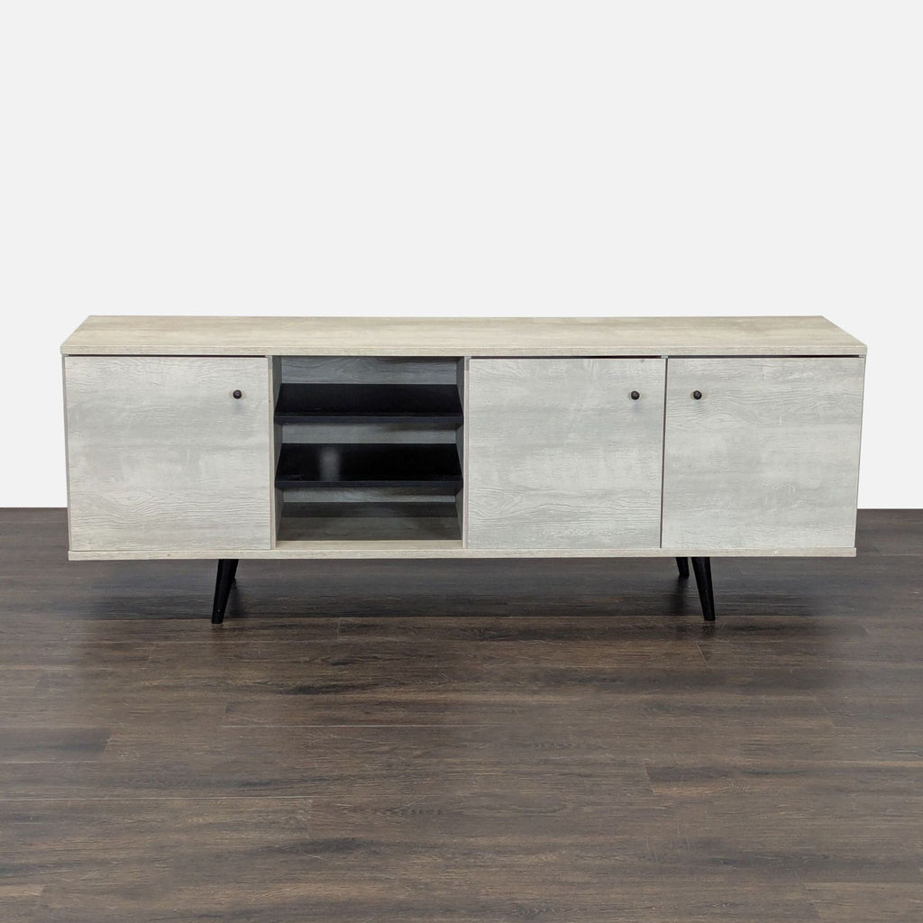 1. Carson Carrington mid-century modern entertainment center in sand finish with three cabinets and open shelving.