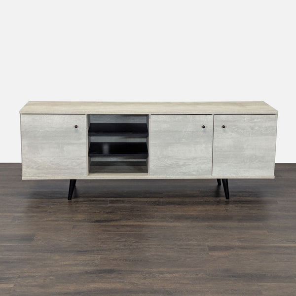 1. Carson Carrington mid-century modern entertainment center in sand finish with three cabinets and open shelving.