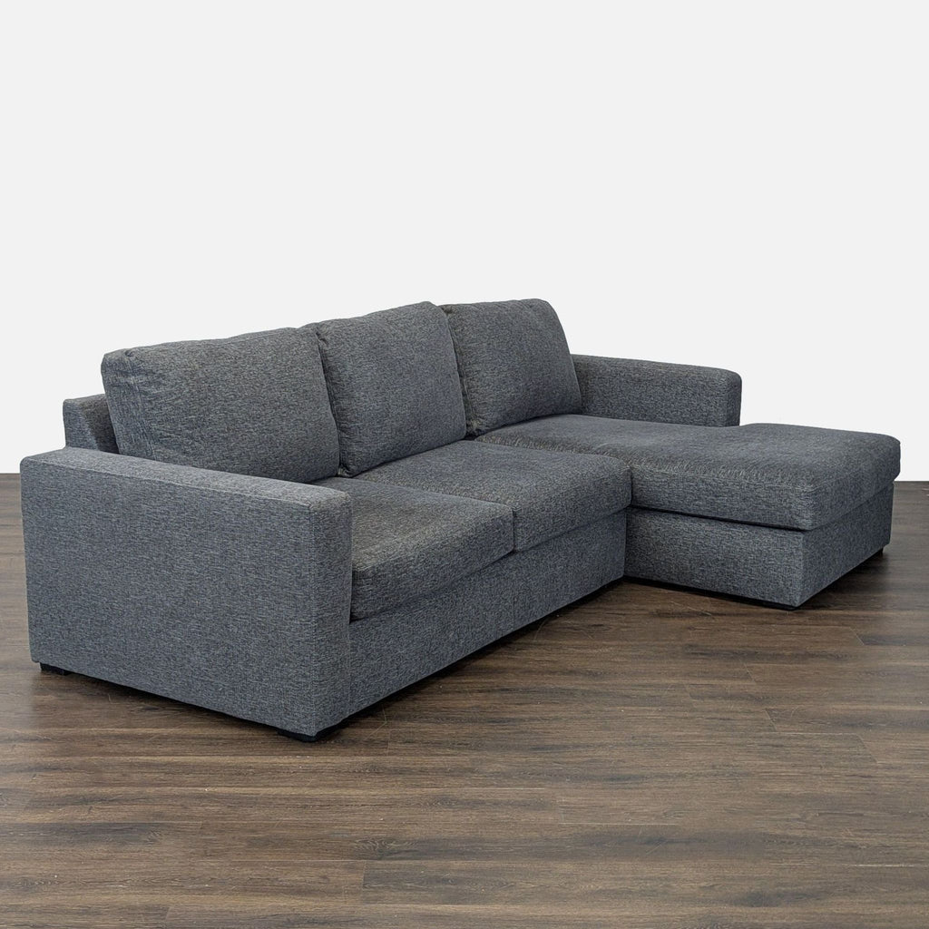 Pewter fabric sectional sofa featuring a chaise lounge and clean, contemporary lines, ideal for living rooms.