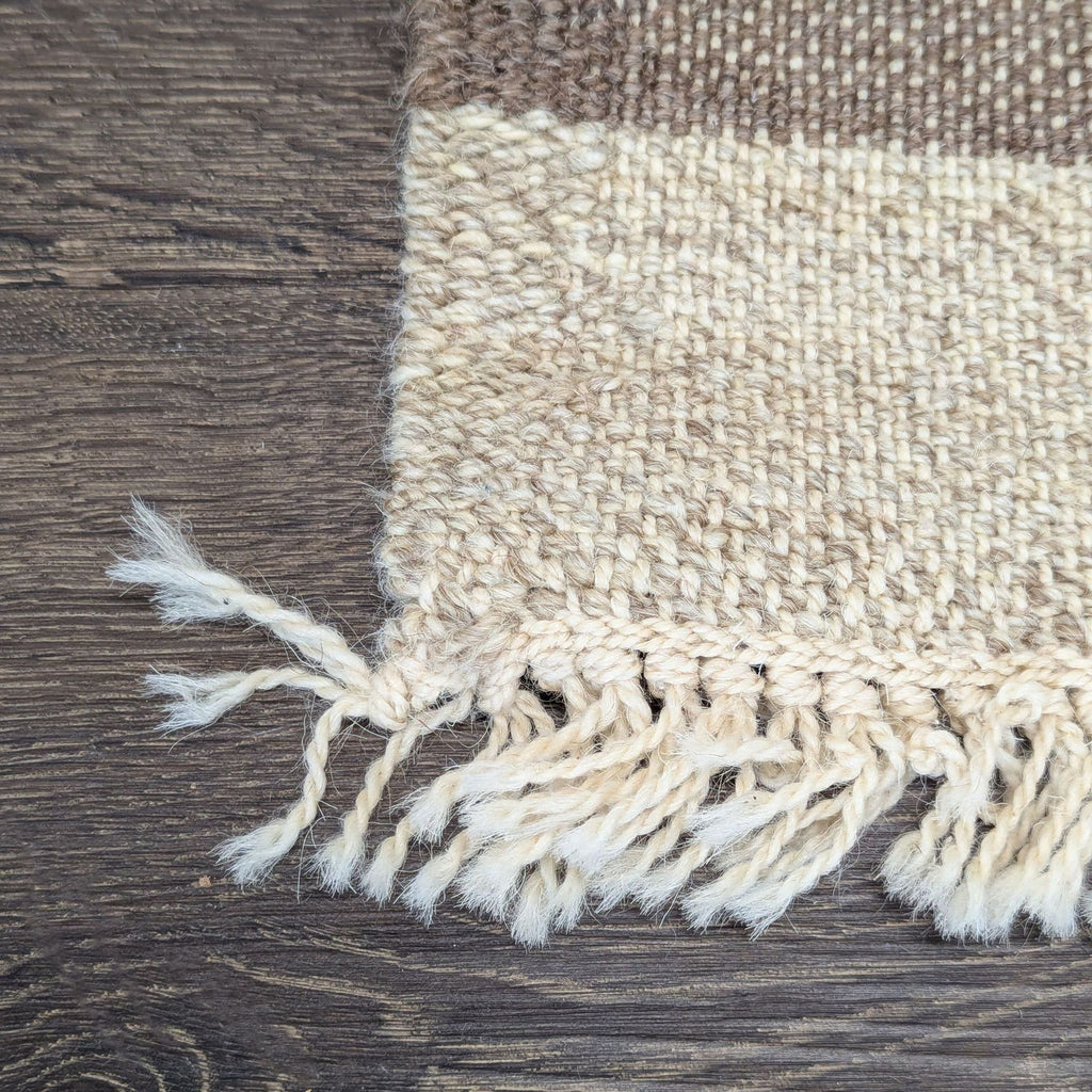 Striped red and beige rug highlighting unique animal and village designs, perfect for a welcoming space.