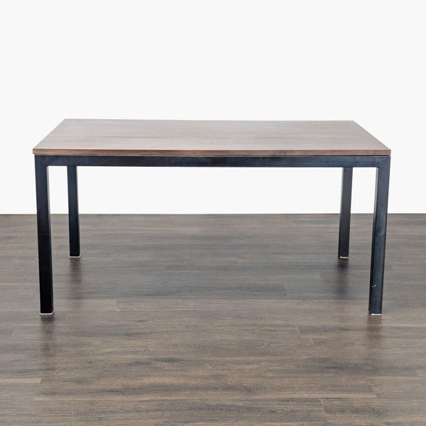 Crate & Barrel dining table with a wooden top and sturdy steel base.  