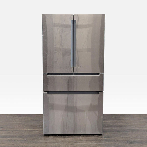 Bosch stainless steel French door refrigerator with twin freezer drawers and adjustable shelves.  