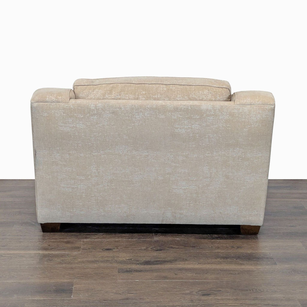Spacious Beige Lounge Chair with Plush Cushion and Modern Design
