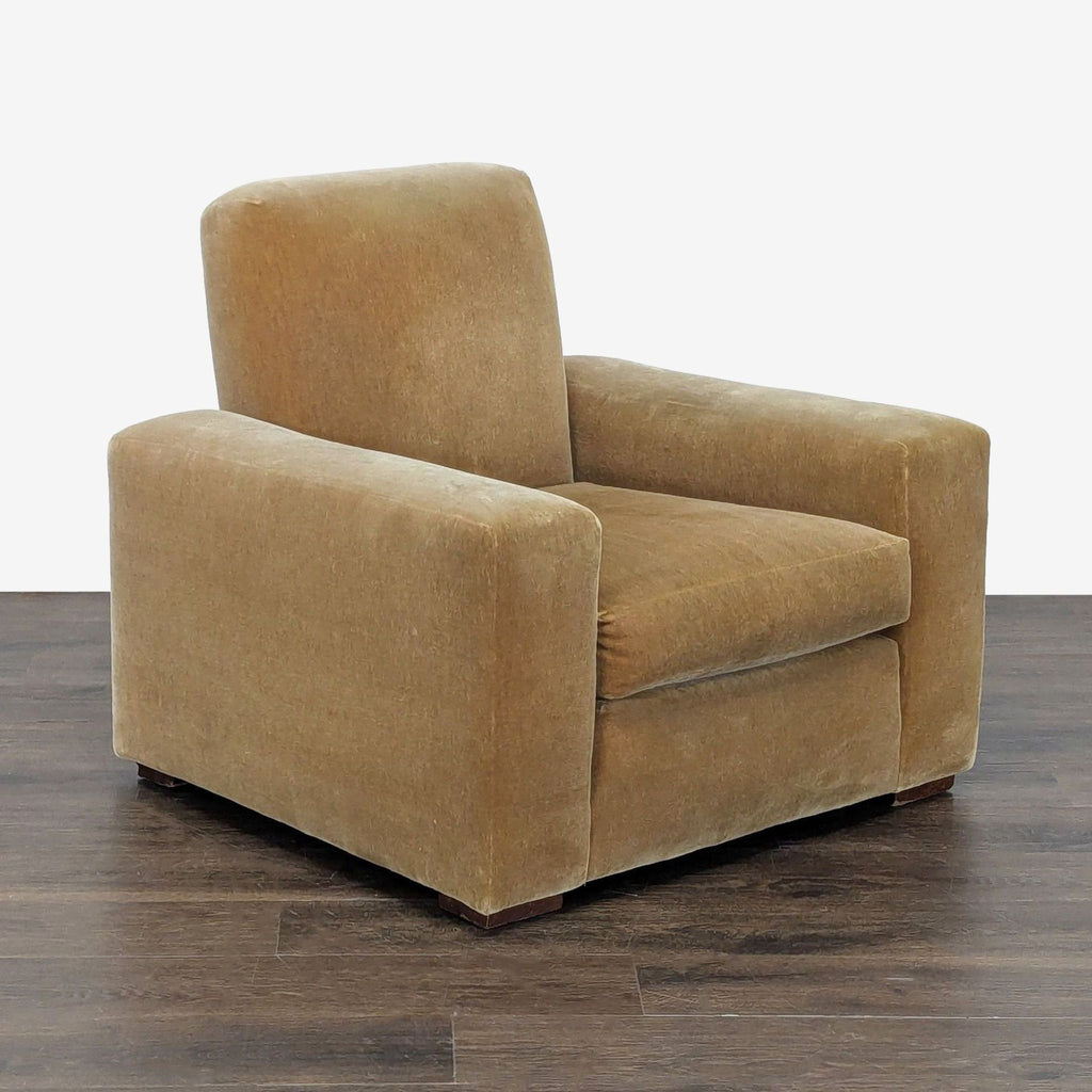 Cozy armchair featuring soft upholstery, thick cushions, and a sturdy build for ultimate comfort.  