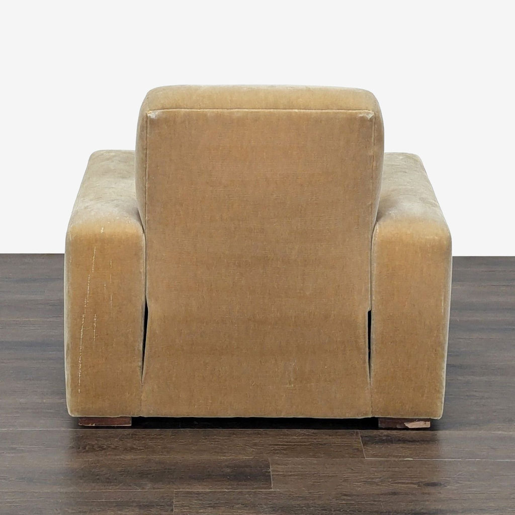 Comfortable lounge seat with plush mustard fabric, wide armrests, and a roomy, inviting design.