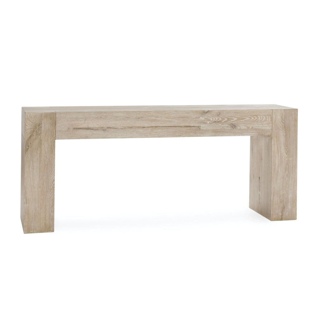 Distressed handcrafted oak side table from Havenly, displaying exposed joinery with large dovetail and bowtie joints.